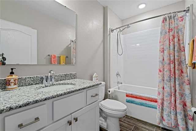 25308 Rupert Rd, Punta Gorda, FL 33983 - bathroom with shower / bath combo with shower curtain, wood finish floors, toilet, and vanity