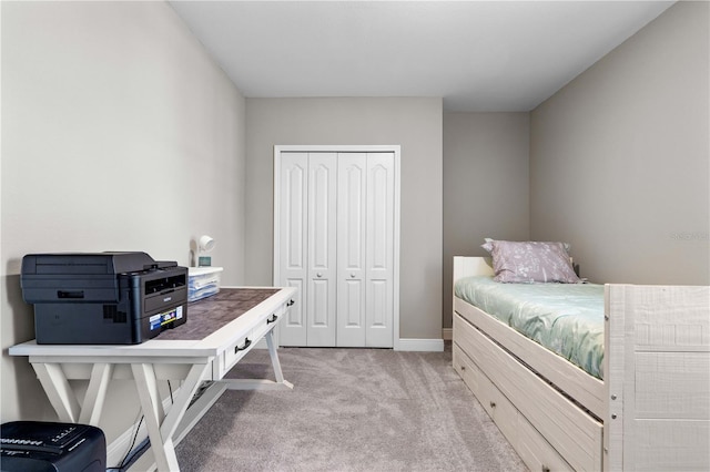 25308 Rupert Rd, Punta Gorda, FL 33983 - bedroom with light carpet, a closet, and baseboards