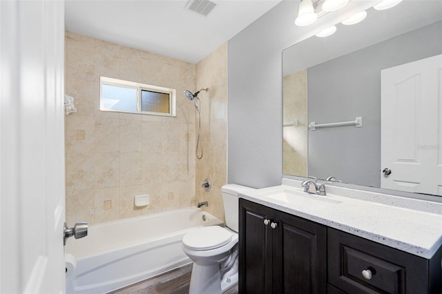 full bath with toilet, shower / bath combination, vanity, and wood finished floors
