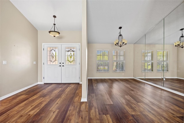 501 Fairmont Ter, Port Charlotte, FL 33954 - foyer with a chandelier, baseboards, and vaulted ceiling
