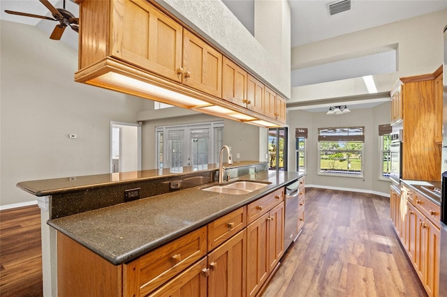 501 Fairmont Ter, Port Charlotte, FL 33954 - kitchen with a sink, dark wood finished floors, stainless steel appliances, ceiling fan, and a high ceiling