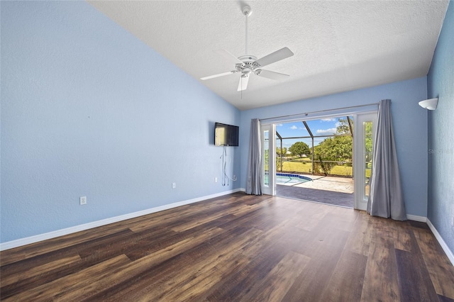 501 Fairmont Ter, Port Charlotte, FL 33954 - spare room featuring a ceiling fan, wood finished floors, baseboards, a textured ceiling, and lofted ceiling