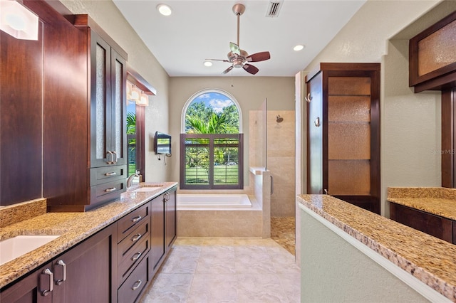 501 Fairmont Ter, Port Charlotte, FL 33954 - full bath with ceiling fan, a tile shower, a bath, double vanity, and recessed lighting