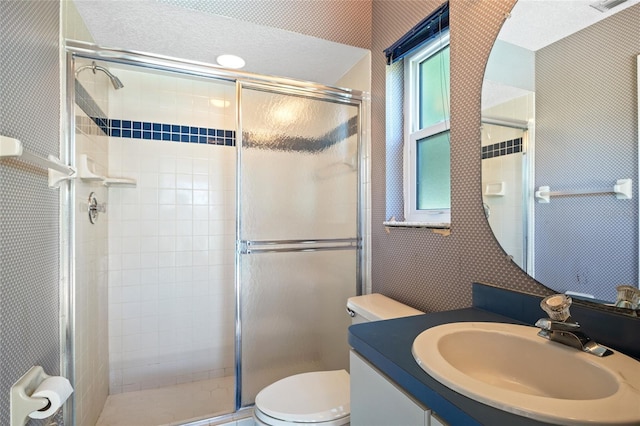 501 Fairmont Ter, Port Charlotte, FL 33954 - bathroom featuring vanity, a stall shower, toilet, and wallpapered walls