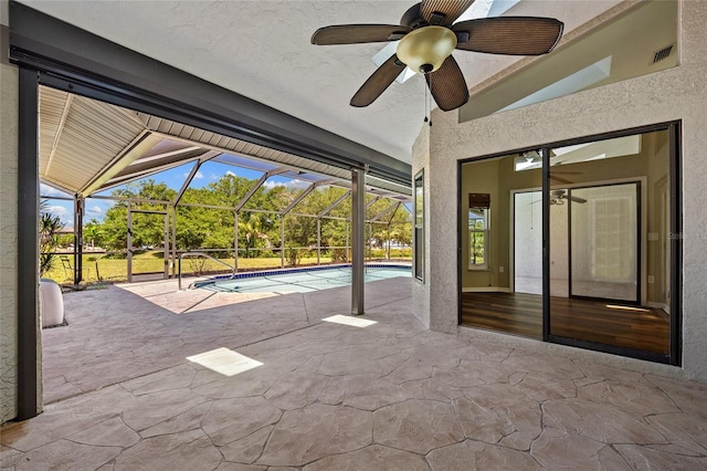 501 Fairmont Ter, Port Charlotte, FL 33954 - outdoor pool featuring ceiling fan, a patio, and glass enclosure