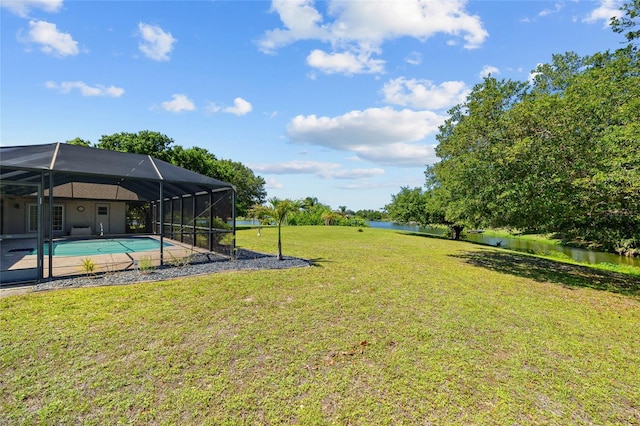 501 Fairmont Ter, Port Charlotte, FL 33954 - view of grassy yard featuring an outdoor pool, a water view, and a lanai