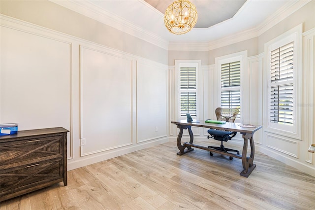 home office featuring a decorative wall, a chandelier, light wood-type flooring, and ornamental molding