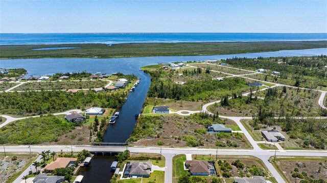 aerial view of residential area featuring a nearby body of water