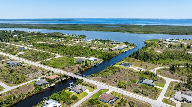 aerial perspective of suburban area with a nearby body of water