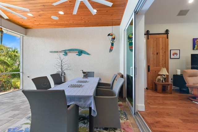329 W Grace St, Punta Gorda, FL 33950 - dining area featuring a ceiling fan, a barn door, recessed lighting, a textured wall, and wooden ceiling