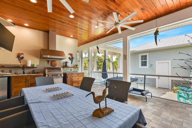 329 W Grace St, Punta Gorda, FL 33950 - dining room featuring a ceiling fan, wooden ceiling, recessed lighting, and light stone finish floors