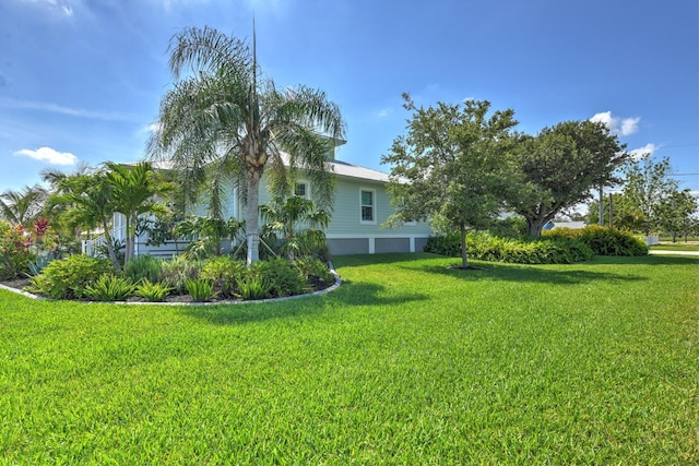 329 W Grace St, Punta Gorda, FL 33950 - view of grassy yard with a garage