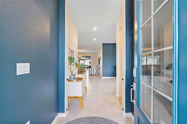 17629 Palmetto Pass Ln, Punta Gorda, FL 33982 - corridor featuring baseboards, a textured wall, tile patterned floors, and recessed lighting