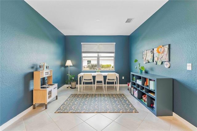 17629 Palmetto Pass Ln, Punta Gorda, FL 33982 - office featuring a textured wall, tile patterned flooring, and baseboards