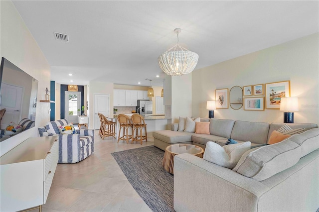 17629 Palmetto Pass Ln, Punta Gorda, FL 33982 - living area with a chandelier, light tile patterned flooring, and recessed lighting