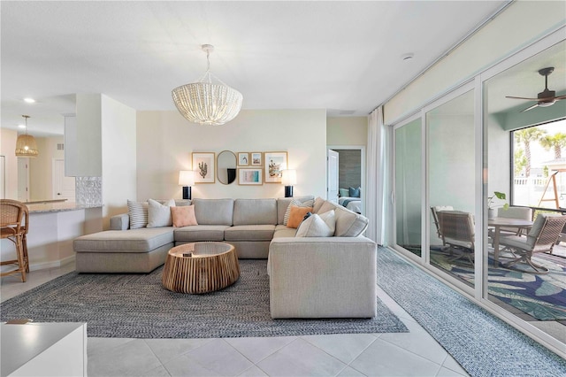 17629 Palmetto Pass Ln, Punta Gorda, FL 33982 - living room featuring a chandelier, light tile patterned flooring, and ceiling fan