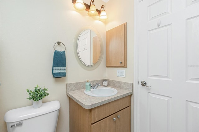 half bath with vanity and toilet