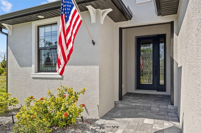 111 Britt Rd, Rotonda West, FL 33947 - doorway to property featuring stucco siding