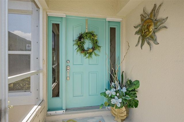 17396 Cox Ave, Port Charlotte, FL 33948 - view of exterior entry featuring stucco siding