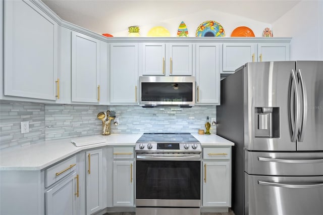 17396 Cox Ave, Port Charlotte, FL 33948 - kitchen featuring appliances with stainless steel finishes, light countertops, and decorative backsplash