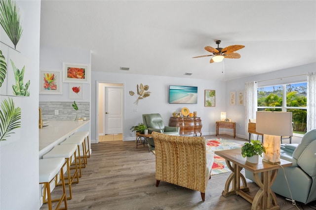 17396 Cox Ave, Port Charlotte, FL 33948 - living room featuring a ceiling fan, wood finished floors, and baseboards