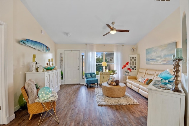 17396 Cox Ave, Port Charlotte, FL 33948 - living area featuring a ceiling fan, wood finished floors, vaulted ceiling, and baseboards