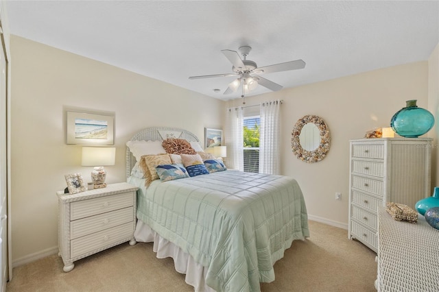 17396 Cox Ave, Port Charlotte, FL 33948 - bedroom featuring light carpet, baseboards, and a ceiling fan