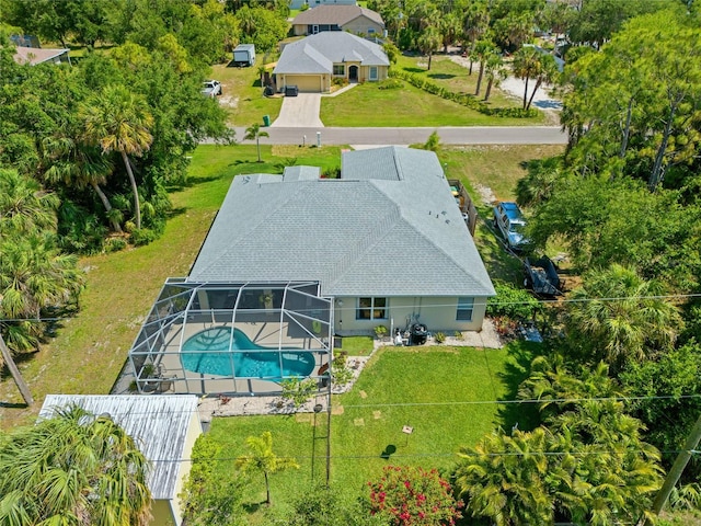 17396 Cox Ave, Port Charlotte, FL 33948 - view from above of property featuring a pool and a tree filled landscape