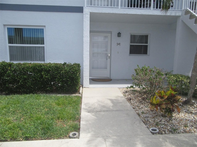 26430 Rampart Blvd Unit 511, Punta Gorda, FL 33983 - view of exterior entry featuring stucco siding