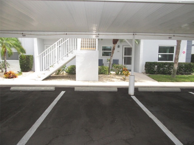 26430 Rampart Blvd Unit 511, Punta Gorda, FL 33983 - covered parking lot with stairs