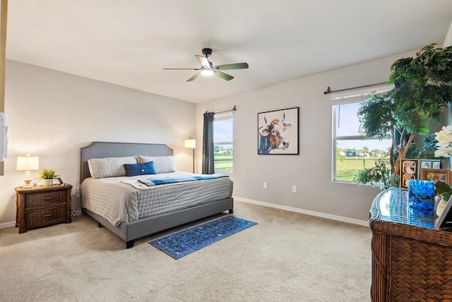 16032 Galiano Ct, Punta Gorda, FL 33955 - carpeted bedroom with baseboards and ceiling fan