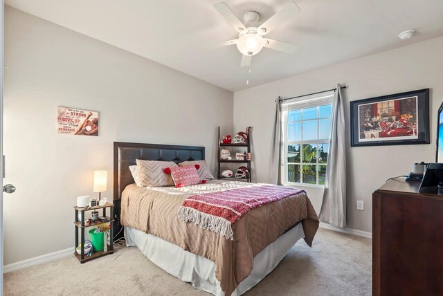 16032 Galiano Ct, Punta Gorda, FL 33955 - carpeted bedroom with baseboards and a ceiling fan