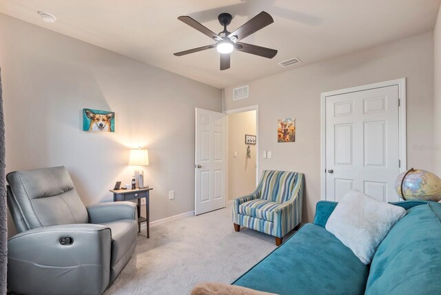 16032 Galiano Ct, Punta Gorda, FL 33955 - carpeted living area with a ceiling fan and baseboards