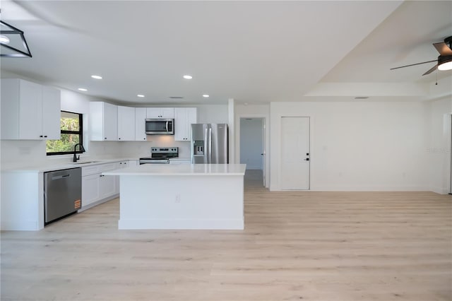 359 Salisbury St, Port Charlotte, FL 33954 - kitchen featuring stainless steel appliances, light wood-style floors, light countertops, recessed lighting, and a kitchen island
