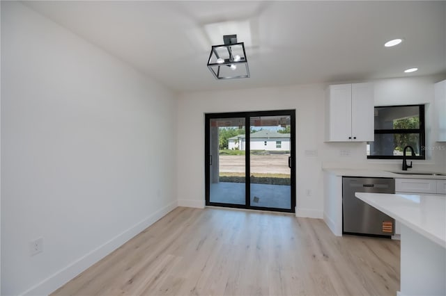 359 Salisbury St, Port Charlotte, FL 33954 - unfurnished dining area featuring a sink, baseboards, light wood-style floors, and recessed lighting