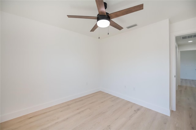 359 Salisbury St, Port Charlotte, FL 33954 - spare room with light wood finished floors, baseboards, and ceiling fan