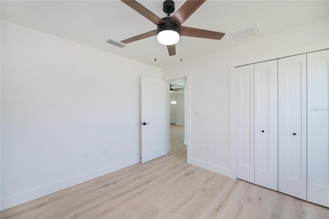 359 Salisbury St, Port Charlotte, FL 33954 - unfurnished bedroom with wood finished floors, baseboards, a closet, and ceiling fan