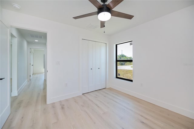 359 Salisbury St, Port Charlotte, FL 33954 - unfurnished bedroom with light wood-style floors, baseboards, a closet, and ceiling fan