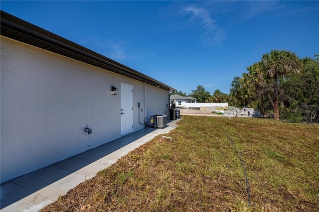 359 Salisbury St, Port Charlotte, FL 33954 - view of grassy yard with central AC