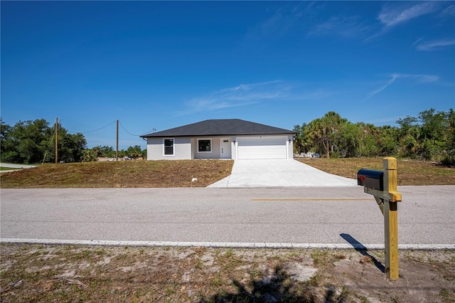359 Salisbury St, Port Charlotte, FL 33954 - view of front facade with driveway and a garage