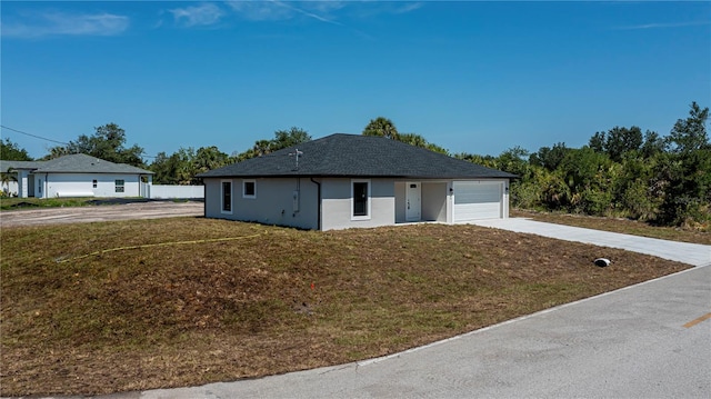 359 Salisbury St, Port Charlotte, FL 33954 - ranch-style home with concrete driveway, a garage, a front lawn, and stucco siding