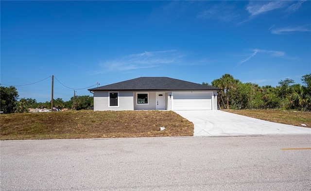 359 Salisbury St, Port Charlotte, FL 33954 - view of front of house featuring a garage, concrete driveway, and stucco siding