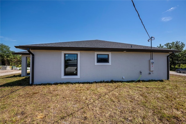 359 Salisbury St, Port Charlotte, FL 33954 - view of property exterior featuring stucco siding and a lawn
