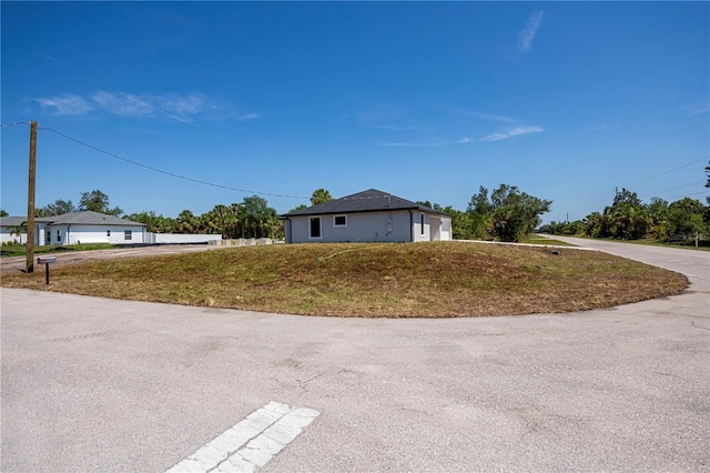 359 Salisbury St, Port Charlotte, FL 33954 - view of side of home featuring a lawn