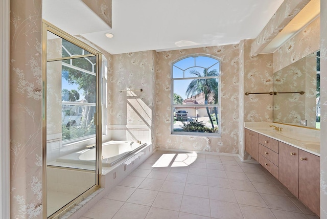 13783 Palmetto Point Ct, Port Charlotte, FL 33953 - bathroom featuring a garden tub, wallpapered walls, tile patterned floors, double vanity, and baseboards