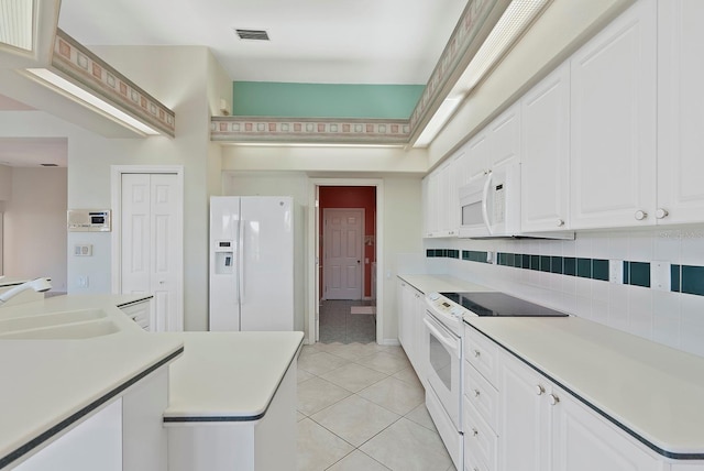 13783 Palmetto Point Ct, Port Charlotte, FL 33953 - kitchen featuring white appliances, a sink, light tile patterned floors, backsplash, and light countertops