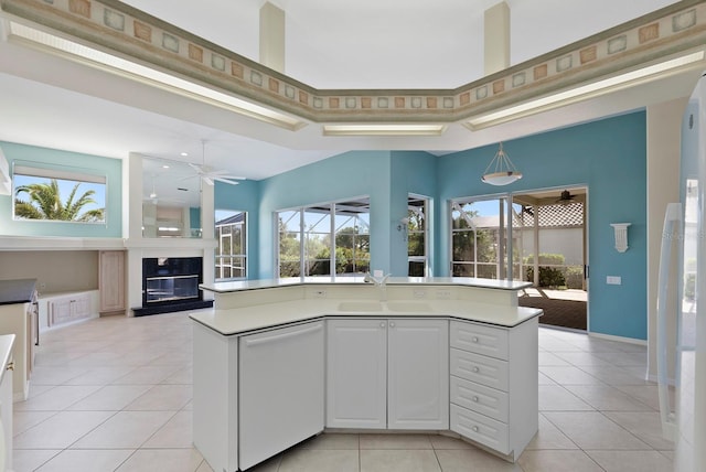 13783 Palmetto Point Ct, Port Charlotte, FL 33953 - kitchen featuring dishwasher, ceiling fan, a sink, light tile patterned floors, and open floor plan