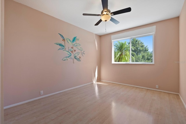 13783 Palmetto Point Ct, Port Charlotte, FL 33953 - unfurnished room with wood finished floors, baseboards, and ceiling fan