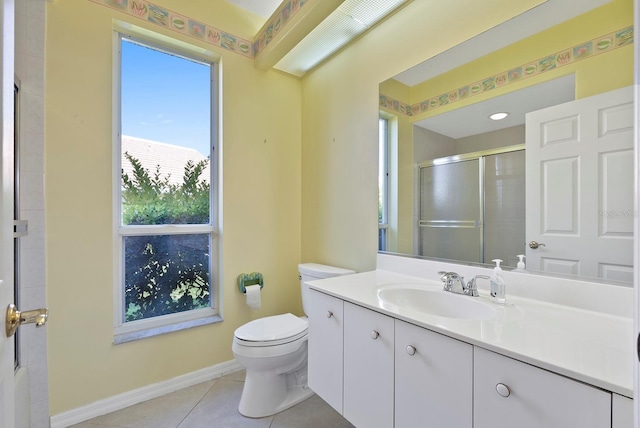 13783 Palmetto Point Ct, Port Charlotte, FL 33953 - bathroom featuring a shower with shower door, toilet, tile patterned floors, vanity, and baseboards