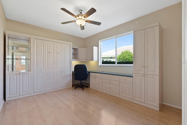 13783 Palmetto Point Ct, Port Charlotte, FL 33953 - home office with light wood-type flooring, ceiling fan, baseboards, and built in study area